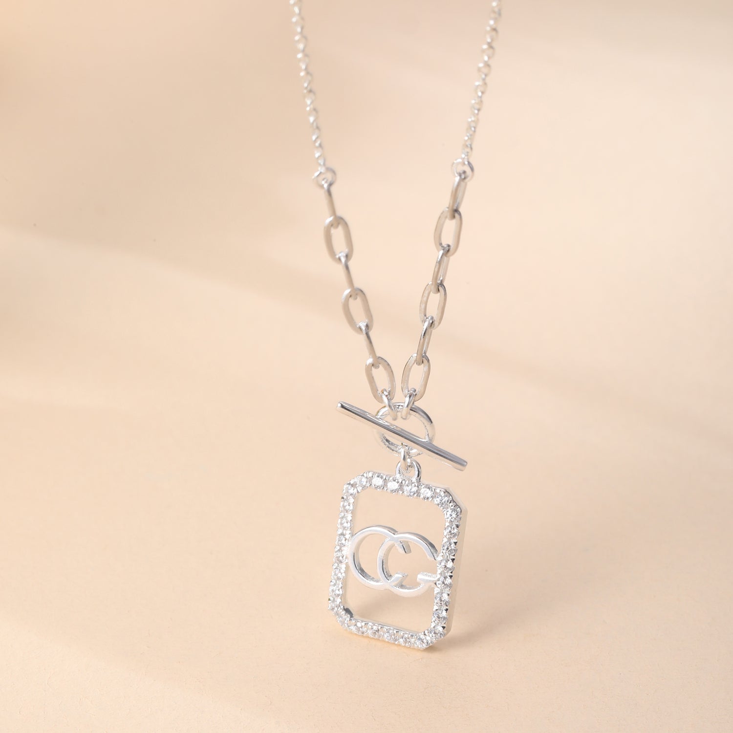 Sterling Silver Cubic Zirconia Embellished Double - Loop Logo Pendant Necklace